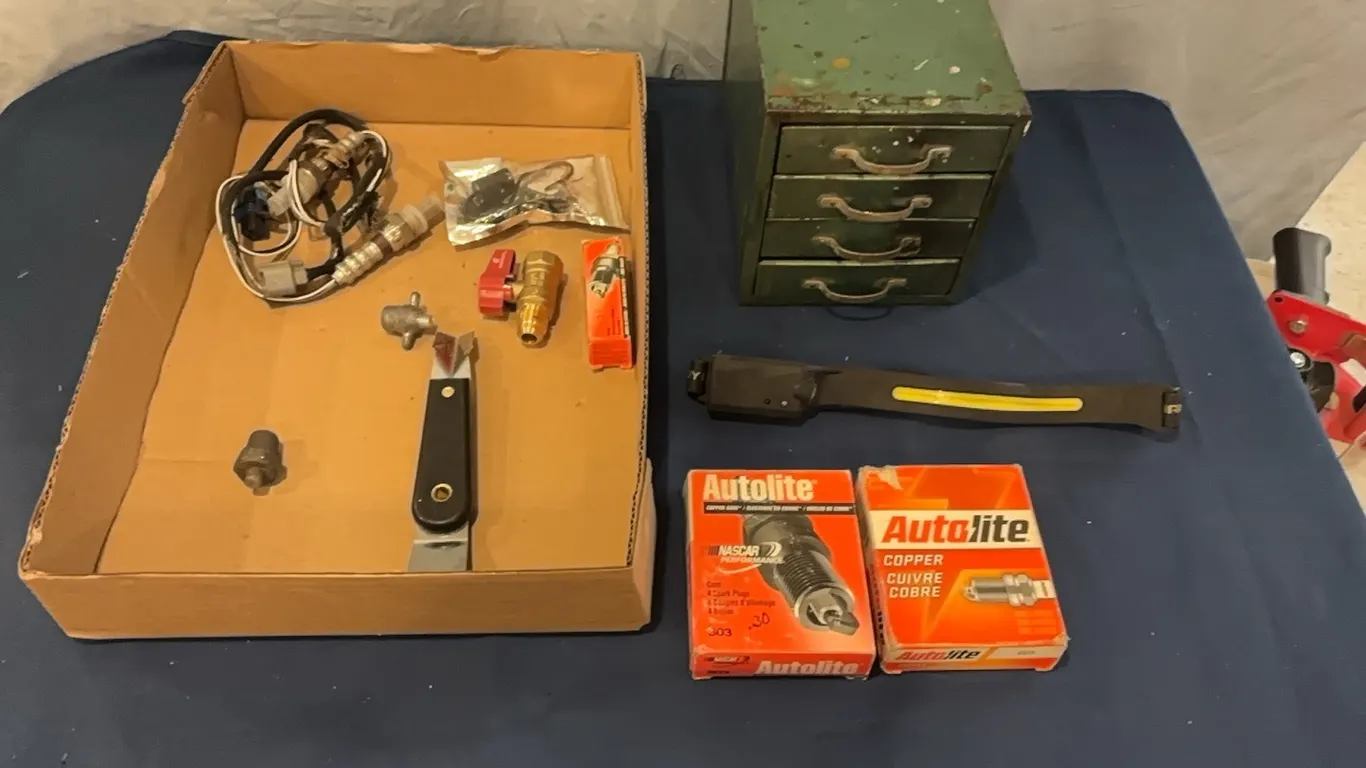 Part storage, head light, and spark plugs