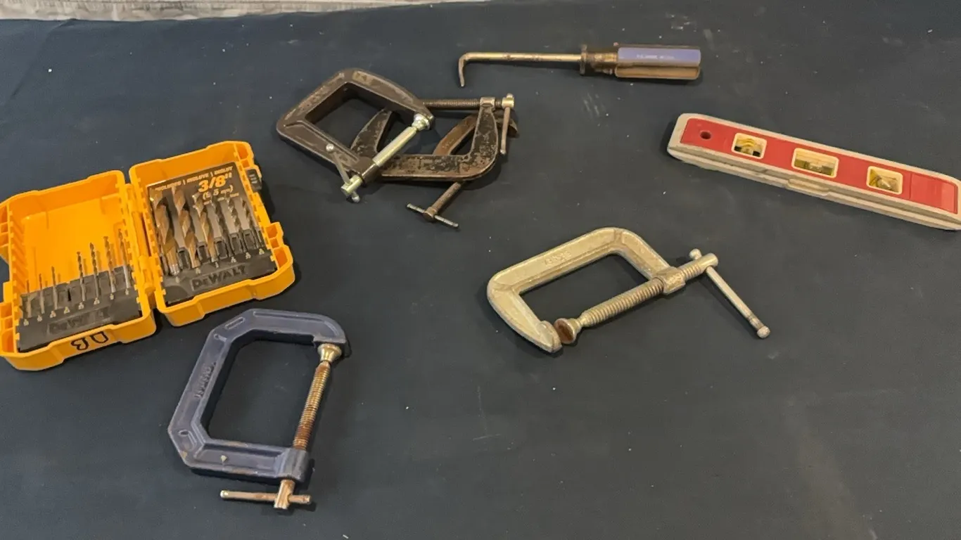 level, drill bits, and C-clamps