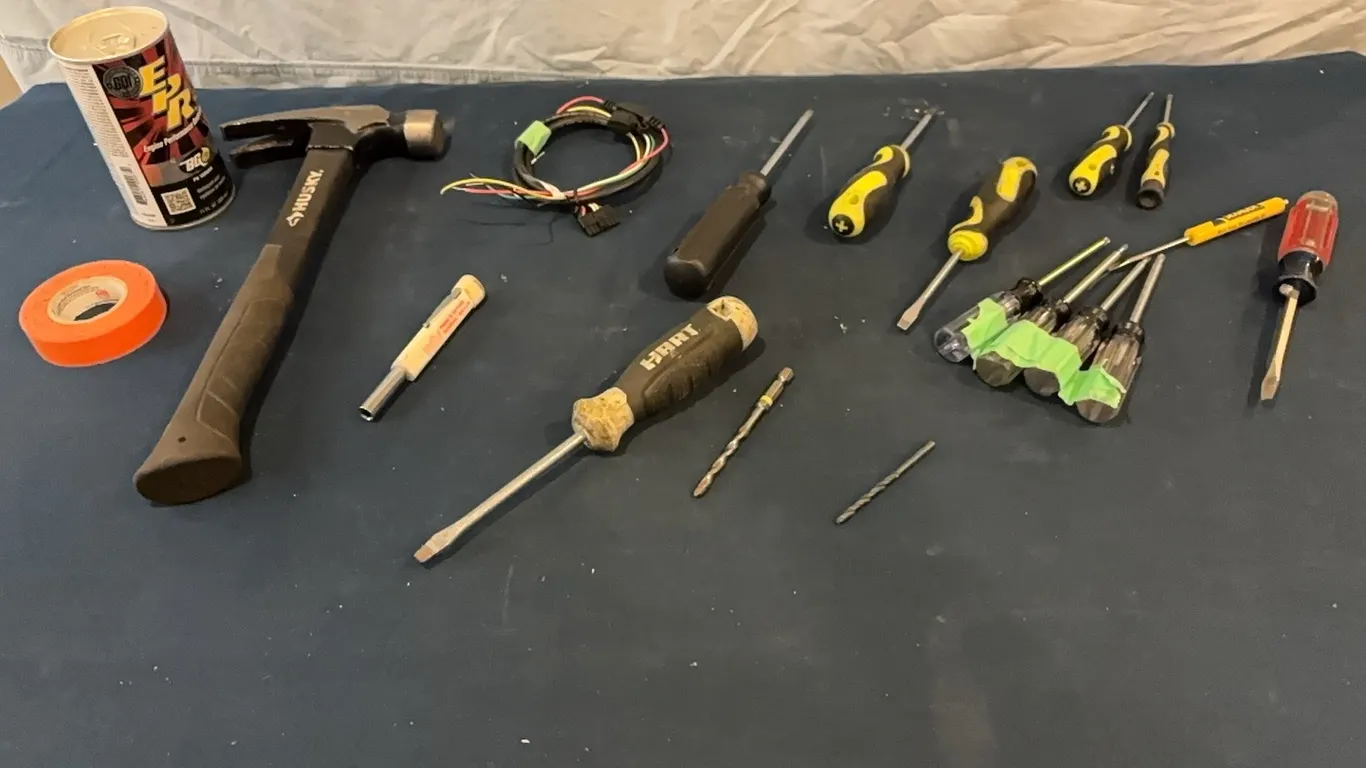 Hammer, screwdrivers, and assorted tools