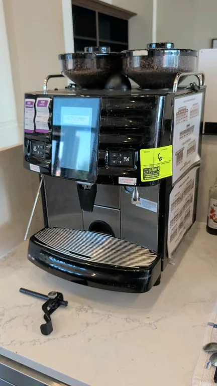 Schaerer SCAP Steam commercial espresso machine. Features dual top bean hoppers, digital touchscreen interface, and stainless steel drip tray. S/N: 22