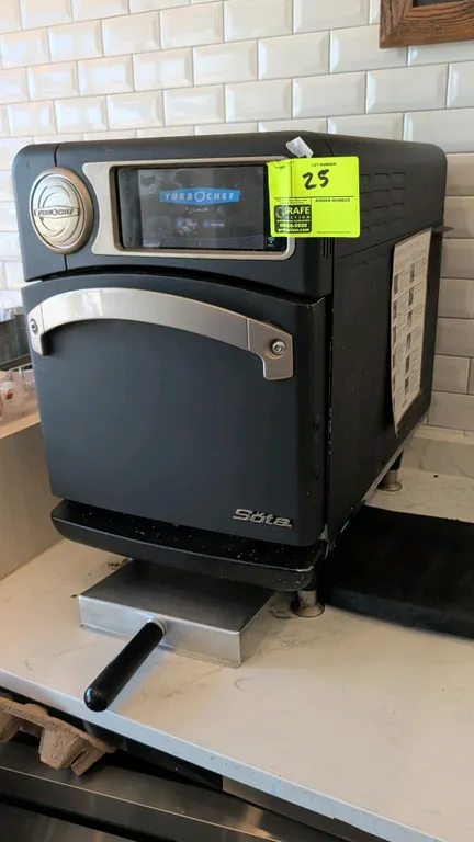 TurboChef Sota countertop rapid cook oven. Features digital touchscreen display, drop-down door, interior wire rack, and metal transfer paddle. Mounte