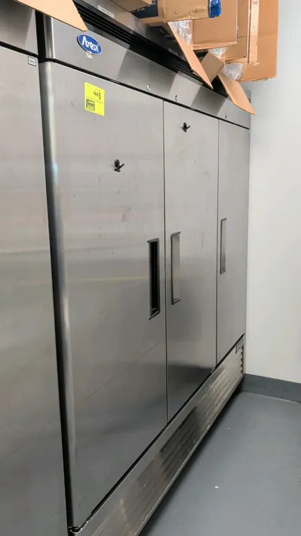 2022 Atosa MBF8508GR 3-door reach-in refrigerator. Features stainless steel exterior, 3 solid hinged doors with recessed handles, and adjustable wire