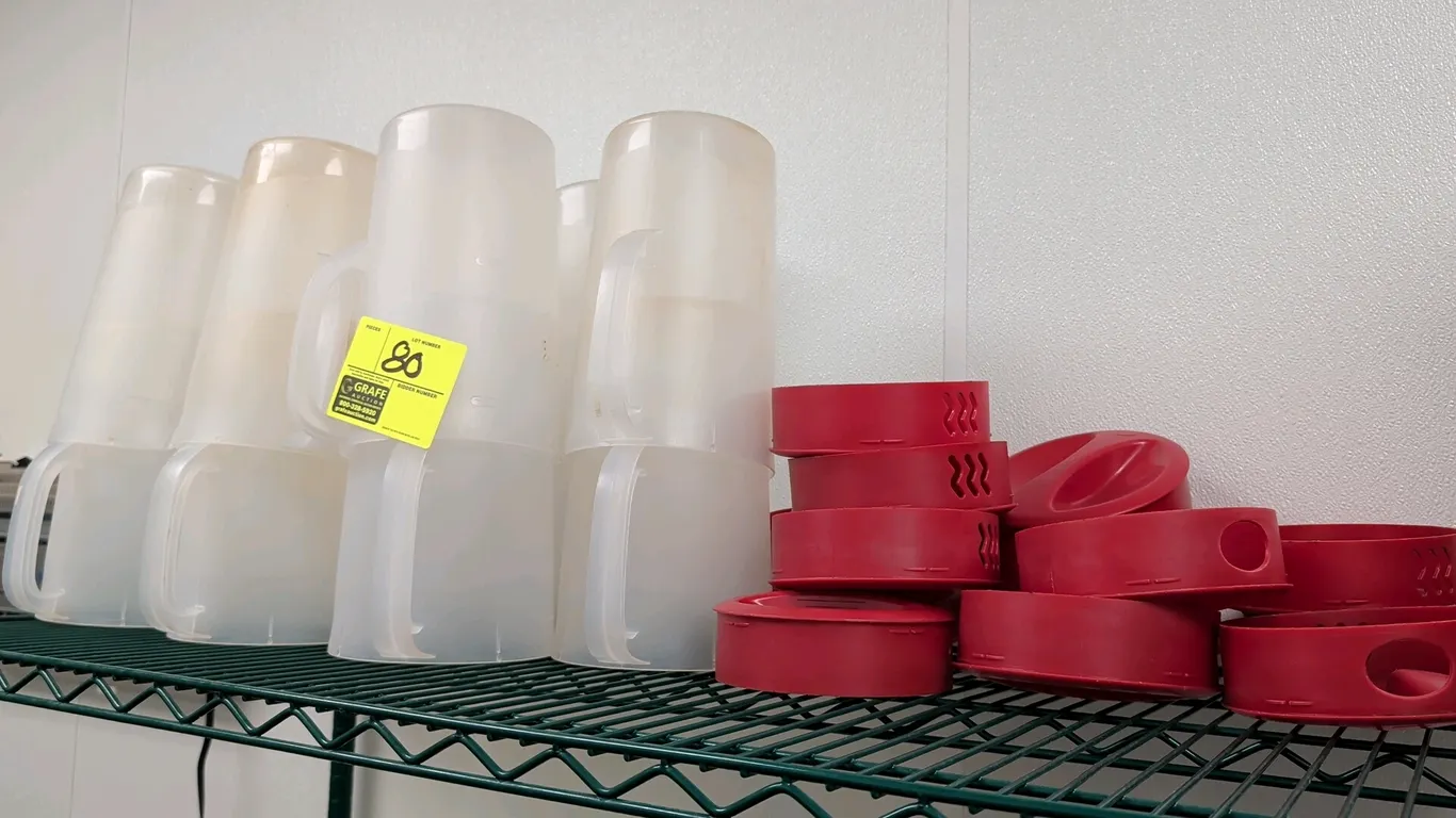 Rubbermaid 1-gallon plastic beverage pitchers with lids. Features semi-translucent plastic construction, integrated side handles, graduated measuremen