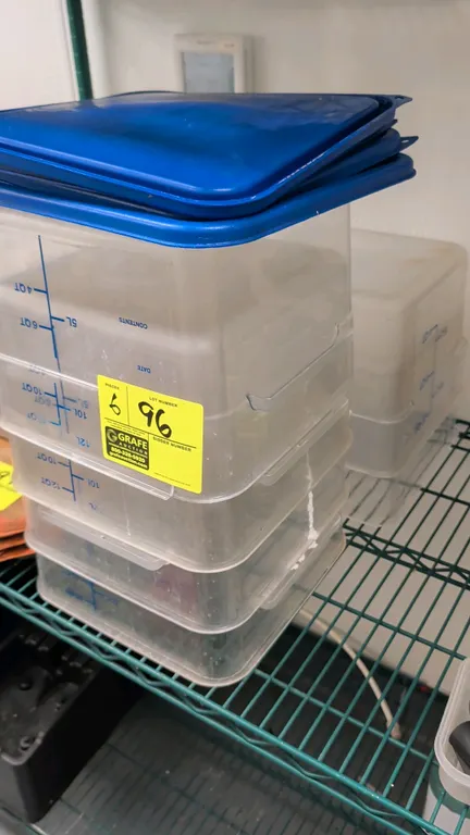 12 qt plastic food storage containers. Features translucent square plastic construction with blue graduated measurement markings. Includes four lids.