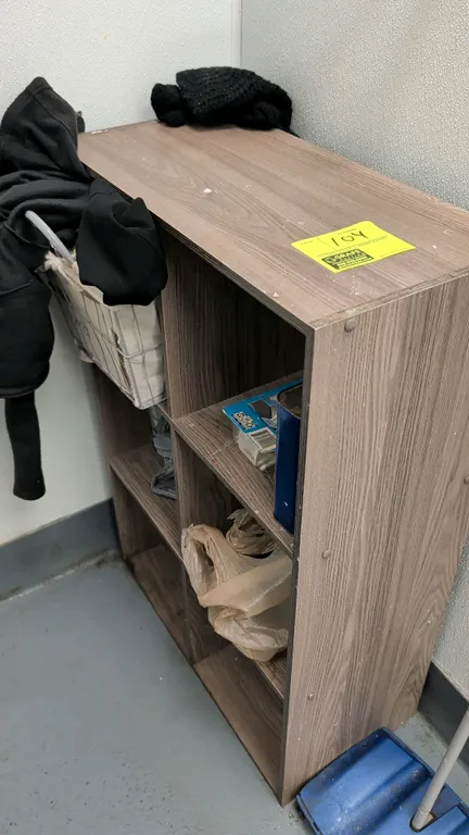 6-cubby storage organizer shelf. Features woodgrain laminate construction with six compartments. 24"W. Contents not included.