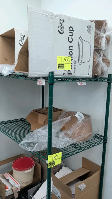 Assorted restaurant supplies and disposables. Includes Choice plastic portion cups, paper food containers, food baskets, aluminum stock pot, and assor