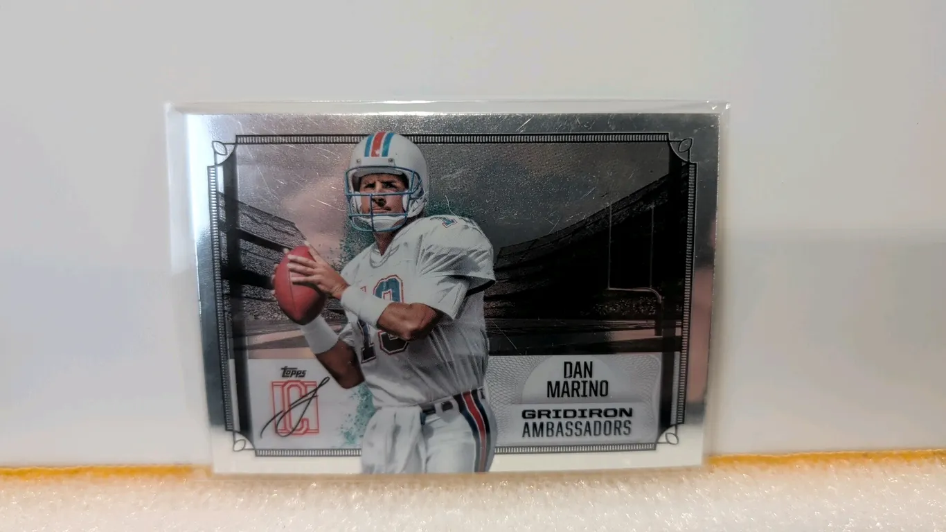 A Dan Marino Topps Gridiron Ambassadors Trading Card. (Topps, 2025) Card number GA-17 featuring Miami Dolphins quarterback Dan Marino from the Gridiro