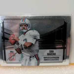 A Dan Marino Topps Gridiron Ambassadors Trading Card. (Topps, 2025) Card number GA-17 featuring Miami Dolphins quarterback Dan Marino from the Gridiro