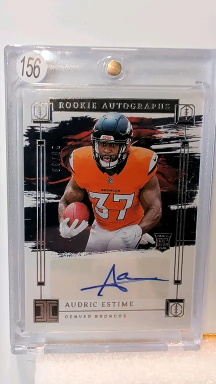 An Audric Estime Rookie Autograph Card. (Panini, 2024) A 2024 Panini Impeccable Football rookie autograph card featuring Denver Broncos running back A
