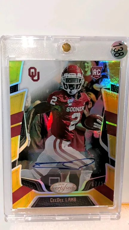 A CeeDee Lamb Signed Rookie Trading Card. (Panini, 2020) A 2020 Panini Chronicles Draft Picks Certified No. 2 rookie card depicting CeeDee Lamb with t