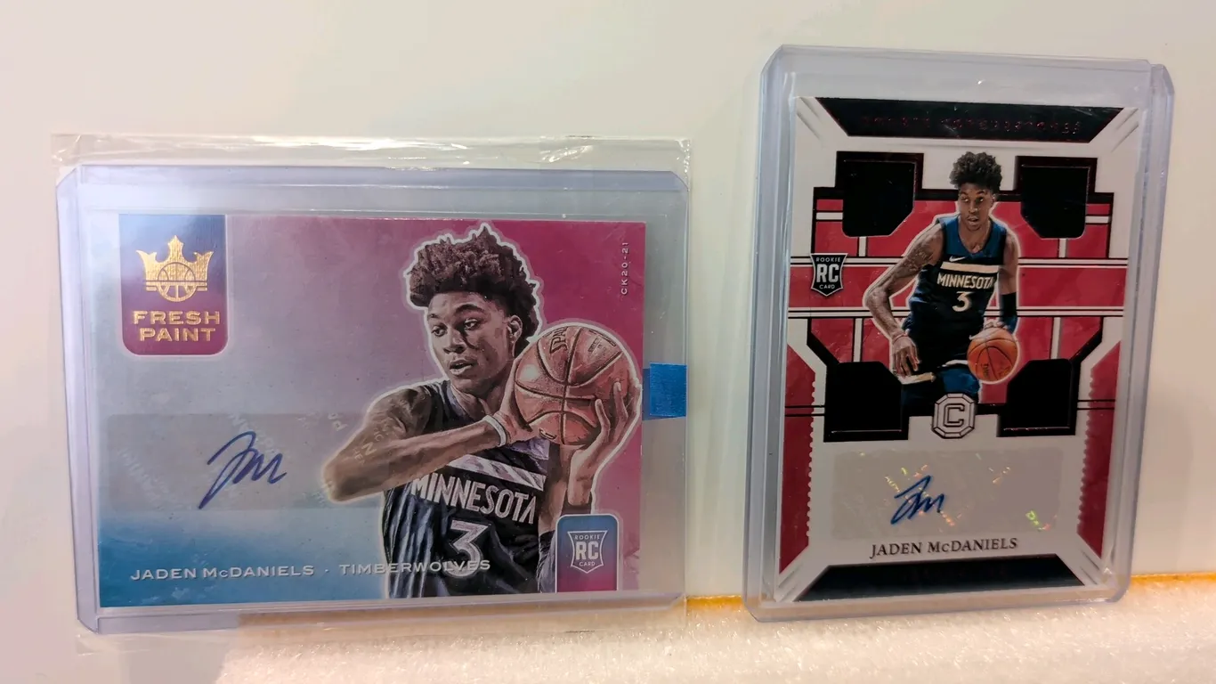 A Pair of Jaden McDaniels Autographed Rookie Cards. (Panini, 2020-21) A lot of (2) Minnesota Timberwolves rookie cards. Includes a Court Kings Fresh P
