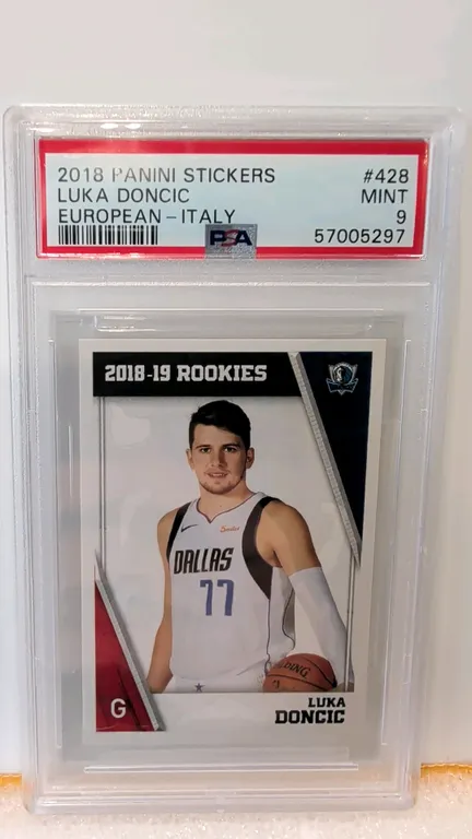 A 2018 Panini Stickers #428 Luka Doncic Rookie Card. (Panini, 2018) A European - Italy variation basketball sticker card depicting Luka Doncic in his