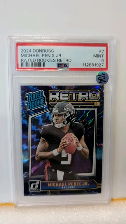 A 2024 Donruss Rated Rookies Retro #7 Michael Penix Jr. Trading Card. (Panini, 2024) Featuring Atlanta Falcons quarterback Michael Penix Jr. Graded PS