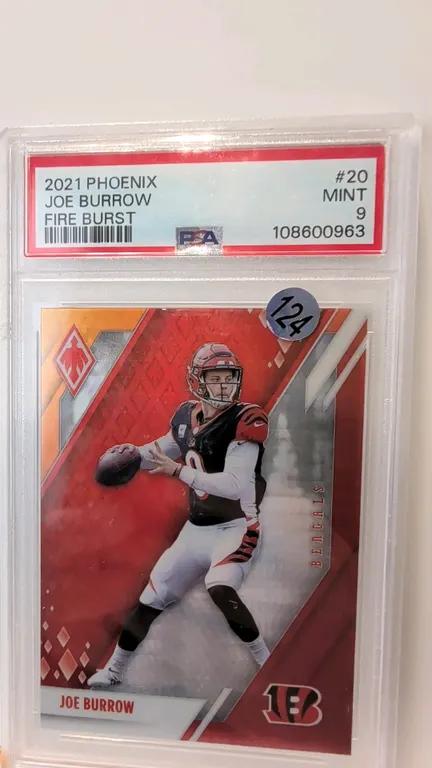 A 2021 Panini Phoenix Fire Burst Joe Burrow #20 Football Card. (Panini, 2021) A Panini Phoenix Fire Burst parallel card featuring Cincinnati Bengals q