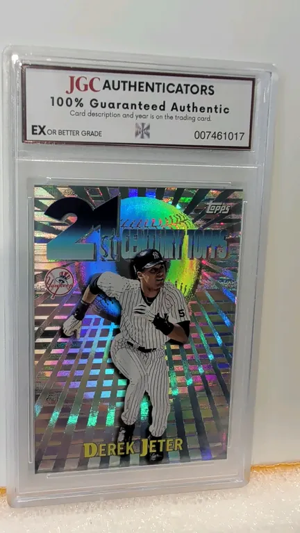 A 1999 Topps 21st Century Derek Jeter Trading Card #C3. (Topps, 1999) Featuring a holographic finish and New York Yankees branding. The card is encaps