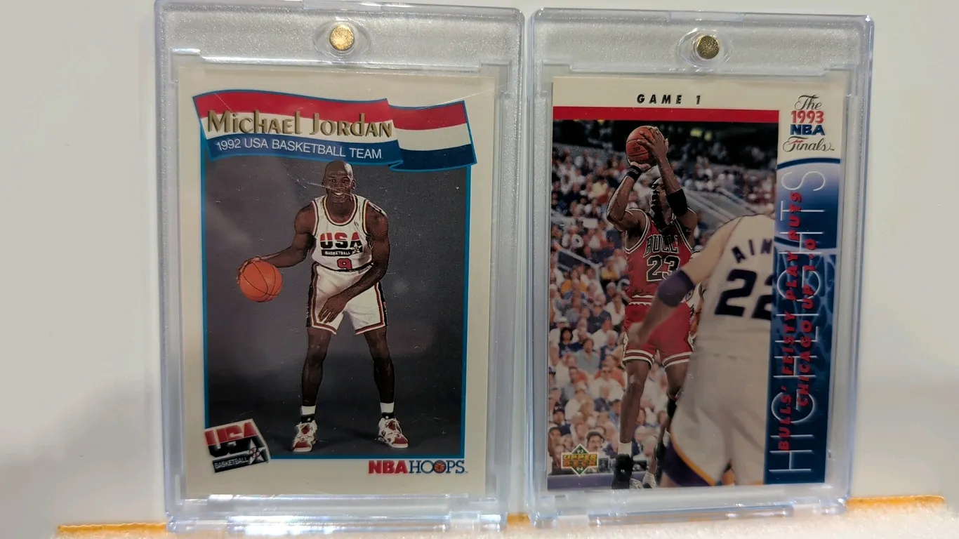 A Pair of Michael Jordan Basketball Trading Cards. (NBA Hoops/Upper Deck, 1991-1993) Includes a 1991-92 NBA Hoops #55 1992 USA Basketball Team card an