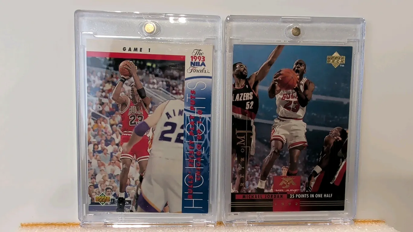 A Pair of Michael Jordan Basketball Cards. (Upper Deck, 1993-1999) Includes a 1993 Upper Deck #198 NBA Finals Game 1 Highlights card and a 1999 Upper