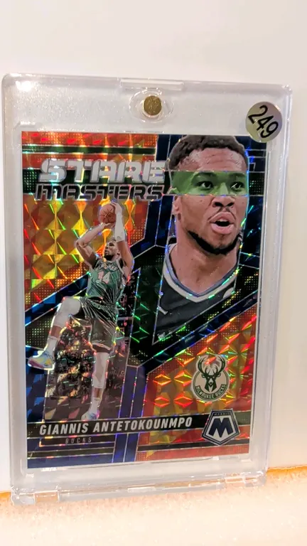 A 2024-25 Panini Mosaic Basketball Giannis Antetokounmpo "Stare Masters" Insert Card. (Panini, 2024-25) Card No. 1 featuring Giannis Antetokounmpo of