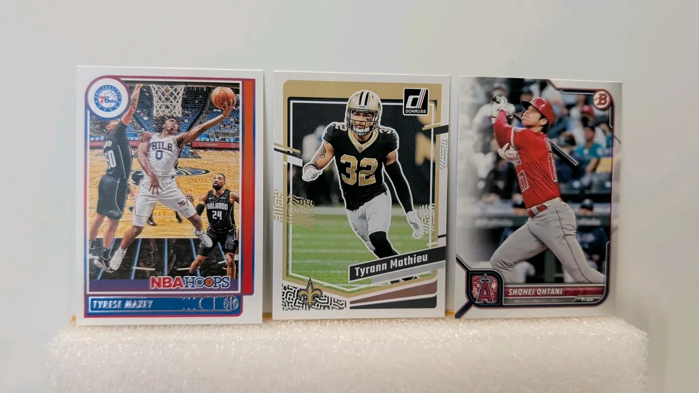 A Collection of (3) Assorted Sports Trading Cards. (Panini/Topps, 2021-2023) Includes a 2022 Bowman Shohei Ohtani #68, 2023 Donruss Tyrann Mathieu #21
