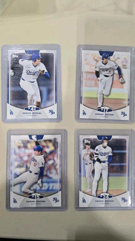 A Collection of Shohei Ohtani 50/50 Club Baseball Cards. (Topps, 2024) A 4-card commemorative lot celebrating Shohei Ohtani's historic 50/50 season wi