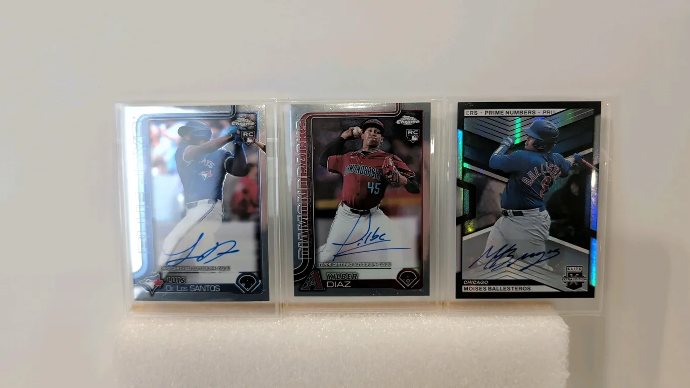 A Collection of (3) Signed Baseball Cards. (Topps/Panini, 2023-2024) A set of certified autographed cards including a Topps Chrome Luis De Los Santos