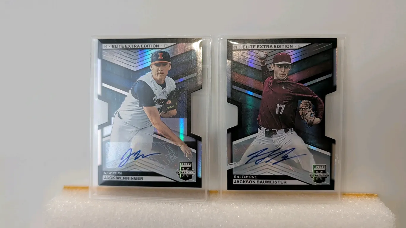 A Pair of Panini Elite Extra Edition Autographed Baseball Cards. (Panini, 2023) Features die-cut designs with certified blue ink signatures. Includes