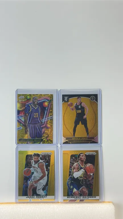 A Collection of (4) NBA Basketball Cards. (Panini/Topps, 2024-2025) Includes 2024-25 Panini Totally Certified Nikola Jokić (#19, 07/10), 2024 Topps Ch