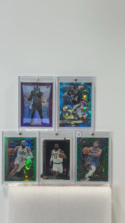 A Collection of (5) Basketball and Football Trading Cards. (Panini/Topps, 2024-2025) Includes 2024 Panini Prizm Sam LaPorta (07/99), Brian Urlacher (6