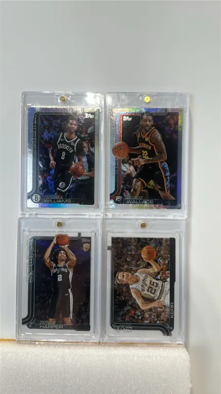 A Collection of Topps Flagship Basketball Trading Cards. (Topps, 2025) A lot of (4) trading cards housed in magnetic one-touch cases, including Ziaire