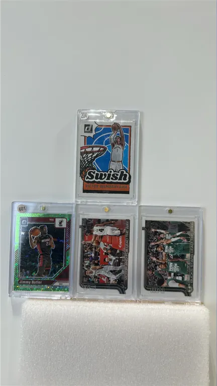 A Collection of NBA Basketball Trading Cards. (Panini/Topps, 2024-2025) Includes 2024-25 Donruss Optic Jimmy Butler Green Prizm #142 (numbered 3/5), D