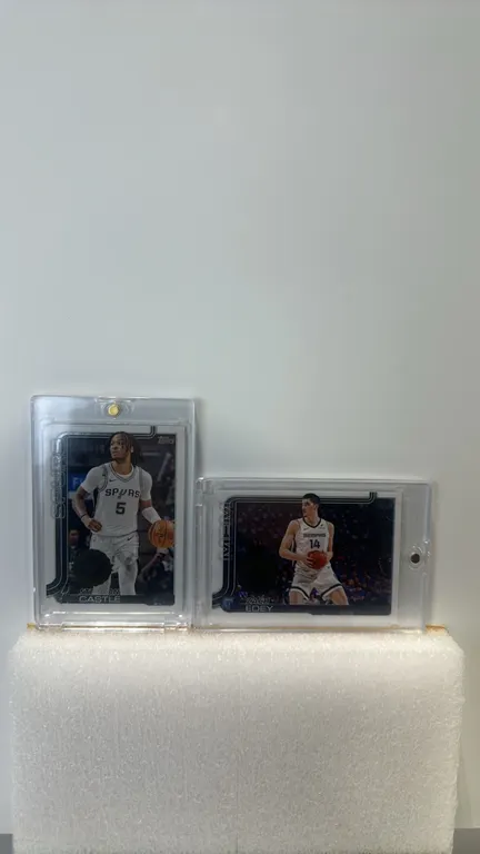 A Pair of 2024-25 Topps Flagship NBA Basketball Cards. (Topps, 2024-25) Includes Stephon Castle (San Antonio Spurs, #197) and Zach Edey (Memphis Grizz