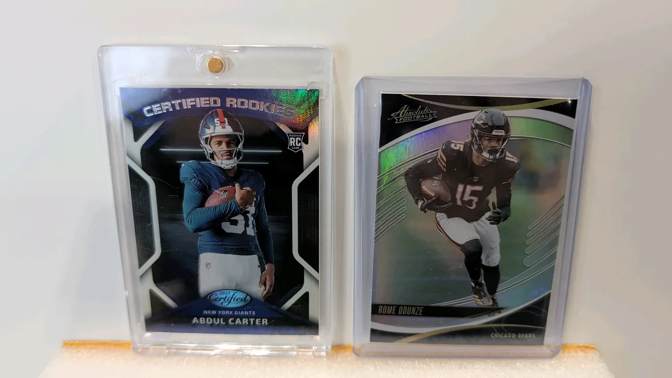 A Pair of Panini Football Cards. (Panini, 2025) Includes an Abdul Carter New York Giants Certified Rookies card No. CRK-ACR housed in a magnetic one-t