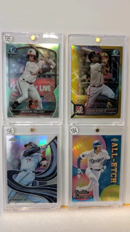 A Collection of (4) Modern Baseball Trading Cards. (Topps/Bowman, 2022-2024) Includes Ronald Acuña Jr. 2022 NSCC (#15/50), Jackson Holliday Bowman Chr