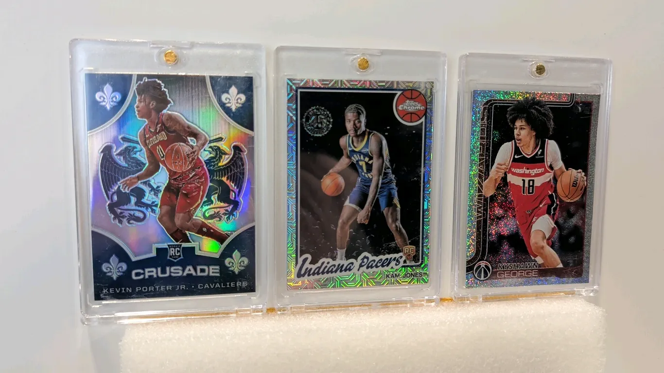 A Collection of NBA Basketball Rookie Trading Cards. (Panini/Topps, 2019-2025) A set of (3) rookie cards including a 2019-20 Panini Chronicles Crusade