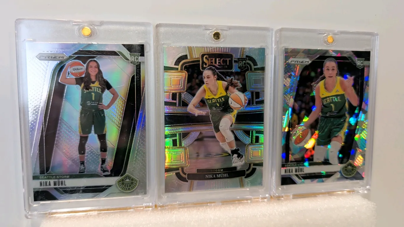 A Collection of Nika Mühl WNBA Rookie Cards. (Panini, 2024) A set of (3) rookie cards featuring Seattle Storm guard Nika Mühl, comprising Prizm Silver