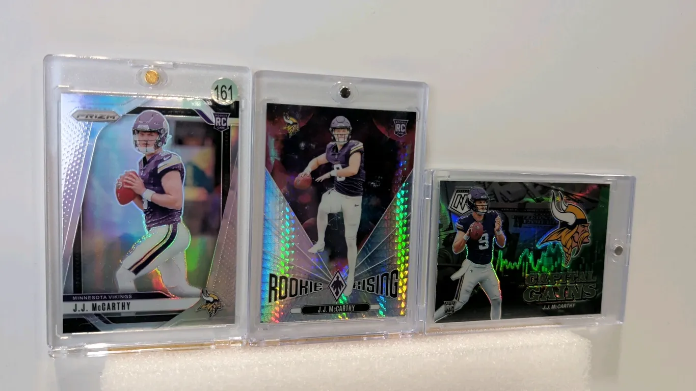 A Collection of 2024 Panini J.J. McCarthy Rookie Cards. (Panini, 2024) A 3-card lot featuring Minnesota Vikings quarterback J.J. McCarthy. Includes Pa
