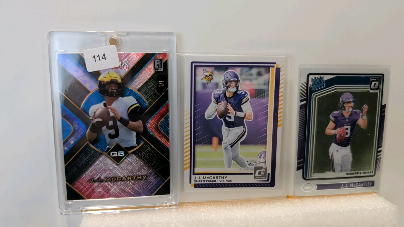 A Collection of J.J. McCarthy Rookie Trading Cards. (Wild Card/Panini, 2024) A 3-card lot featuring Michigan and Minnesota Vikings quarterback J.J. Mc