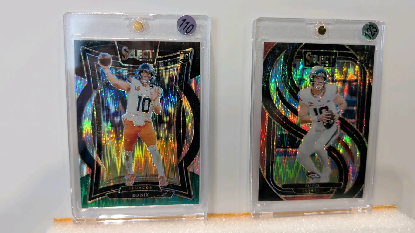 A Pair of Bo Nix 2024 Panini Select Rookie Cards. (Panini, 2024) Includes No. 117 Premier Level Prizm and No. 30 Concourse cards, both featuring the D