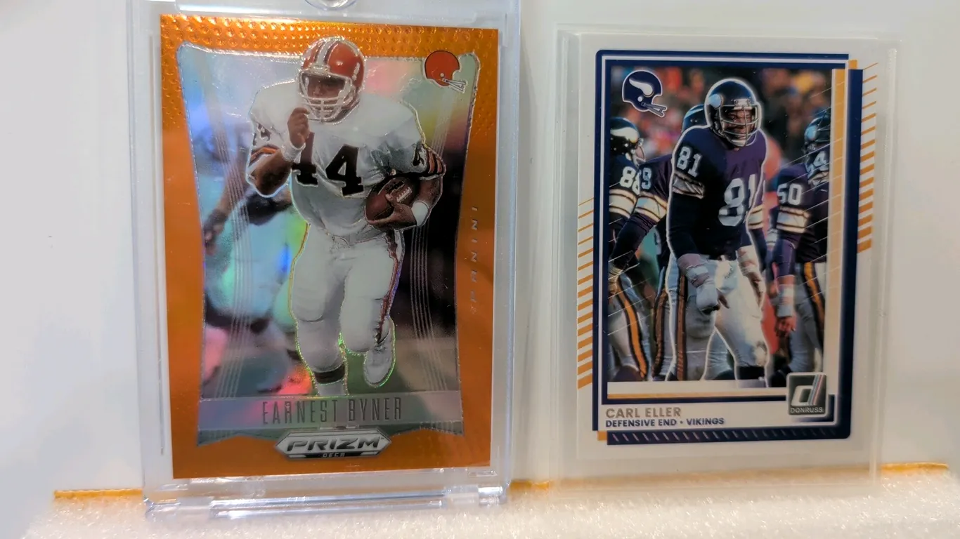 A Pair of Panini NFL Trading Cards. (Panini, 2024-2025) A collection of (2) football cards including a 2024 Panini Prizm Deca Earnest Byner (Cleveland