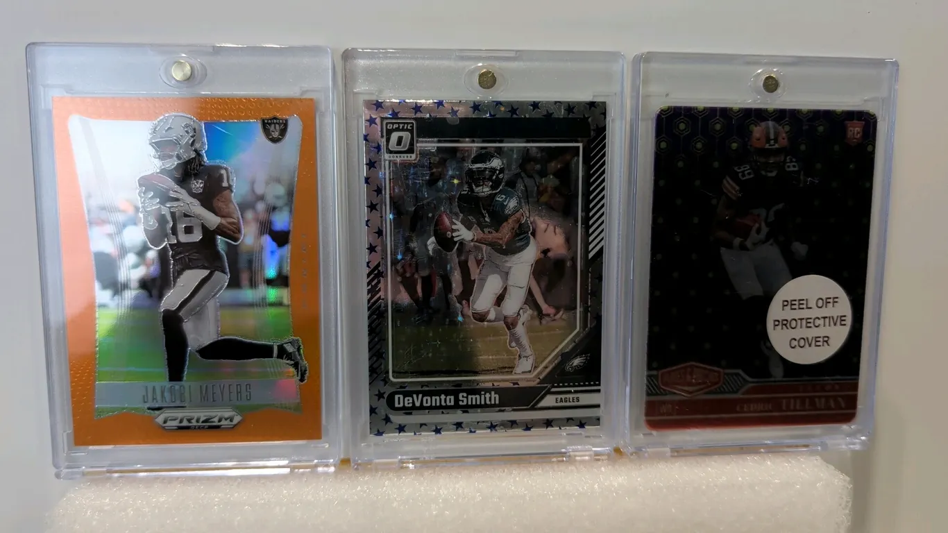 A Collection of (3) Panini Football Trading Cards. (Panini, 2023-2024) Includes a 2024 Prizm Deca Jakobi Meyers numbered 20/49, 2024 Donruss Optic DeV