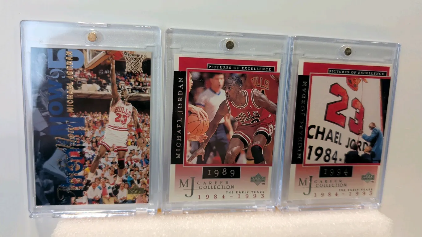 A Collection of Upper Deck Michael Jordan Trading Cards. (Upper Deck, 1995-1998) A set of (3) cards including 1995 "Then & Now" No. 359, and 1998 MJ C