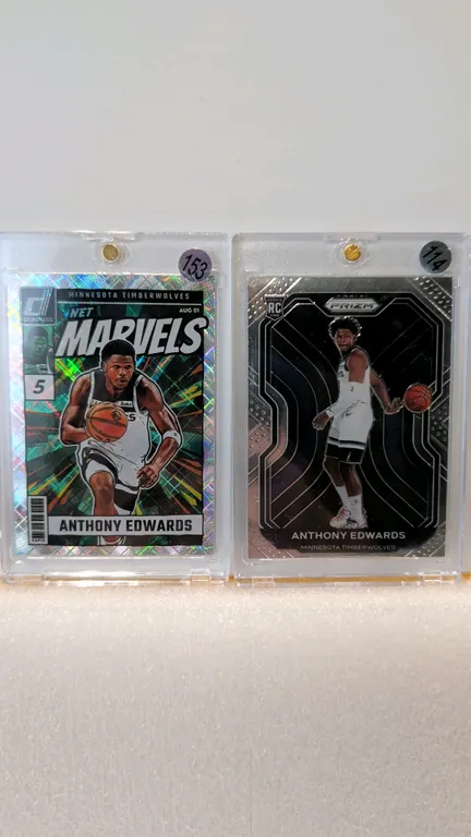 A Pair of Anthony Edwards Basketball Cards. (Panini, 2020-2024) A pair of Anthony Edwards Minnesota Timberwolves cards comprising a 2020-21 Prizm Rook