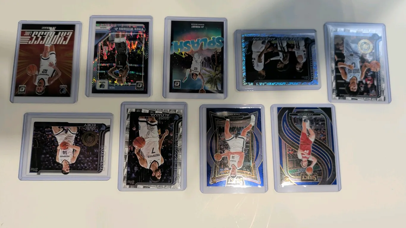 A Collection of 2024-25 Memphis Grizzlies Basketball Cards. (Panini/Topps, 2024-2025) A lot of (9) trading cards from Panini Select, Donruss Optic, an