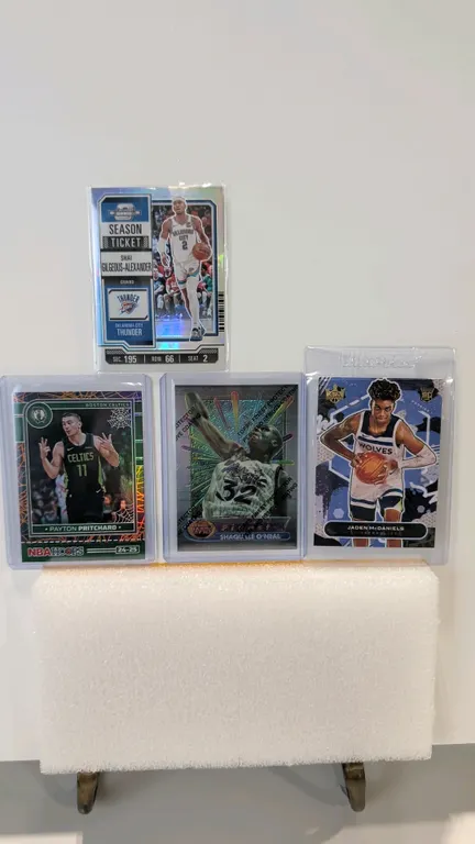 A Collection of (4) Assorted NBA Basketball Cards. (Panini/Topps, 1994-2025) Includes 2023-24 Panini Contenders Optic Shai Gilgeous-Alexander No. 81,