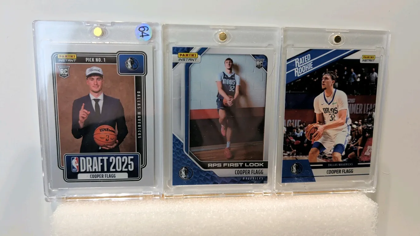 A Collection of Cooper Flagg Panini Instant Basketball Cards. (Panini, 2025-26) A 3-card lot featuring Dallas Mavericks rookie Cooper Flagg. Includes