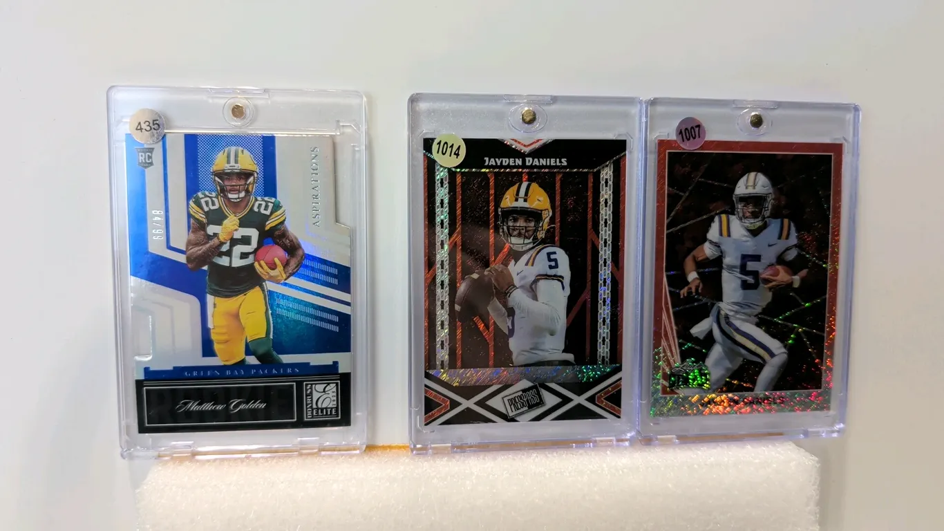A Collection of (3) Football Trading Cards. (Panini/Leaf, 2024-2025) Includes 2025 Panini Donruss Elite Matthew Golden Aspirations numbered 84/99 (No.