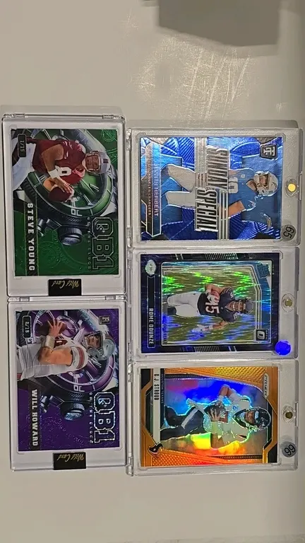 A Collection of 2024 Football Trading Cards. (Panini/Wild Card, 2024) Includes Steve Young Wild Card QB1 Green Foil 1/15, Will Howard Wild Card QB1 Ro