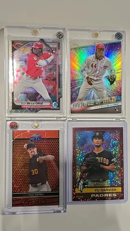 A Collection of MLB Trading Cards. (Topps/Leaf, 2024-2025) A lot of 4 baseball cards featuring 2024 Bowman Chrome Elly De La Cruz Mojo RC #22, 2024 To