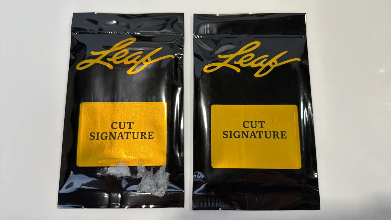 A Pair of Leaf Cut Signature Trading Card Packs. (Leaf Trading Cards, 2023) A pair of factory-sealed trading card packs featuring black foil packaging