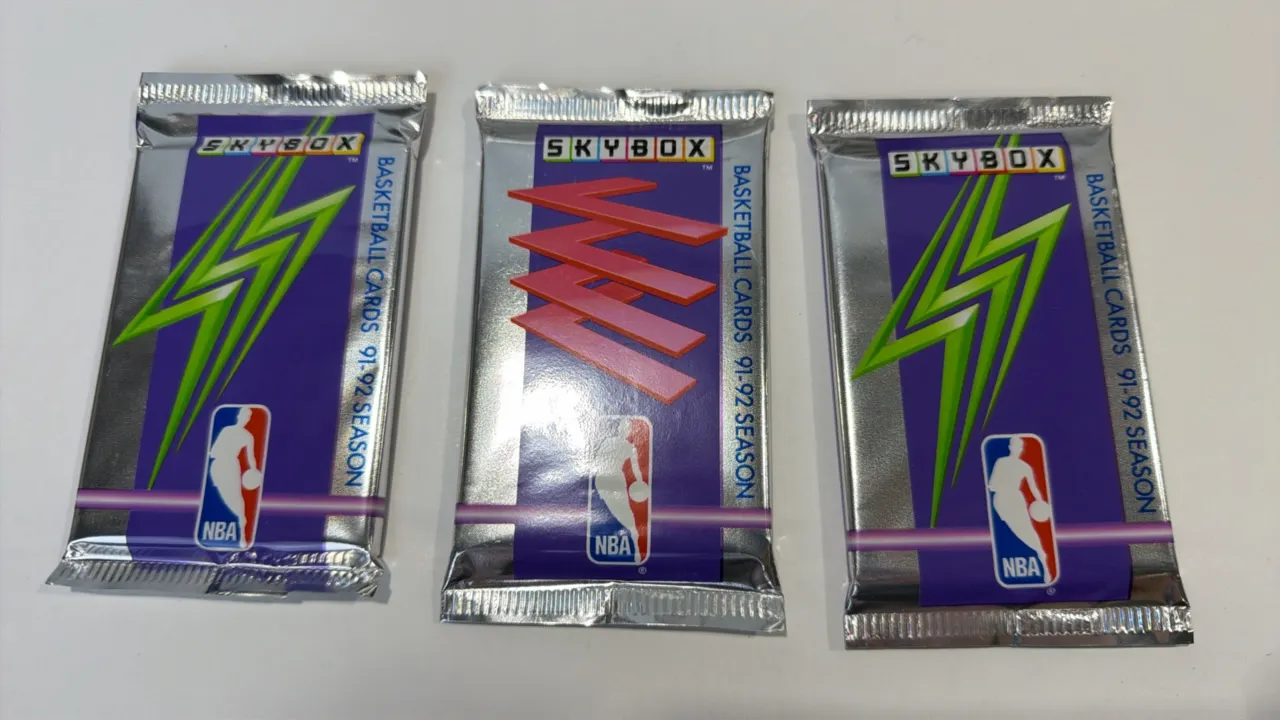 A Collection of 1991-1992 Skybox NBA Sealed Basketball Card Packs. (Skybox, 1991) A group of (3) original factory-sealed foil packs from the 1991-1992